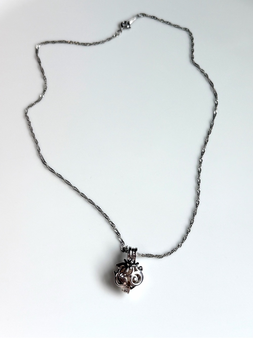 White Gold OM pearl cage pendant necklace on chain